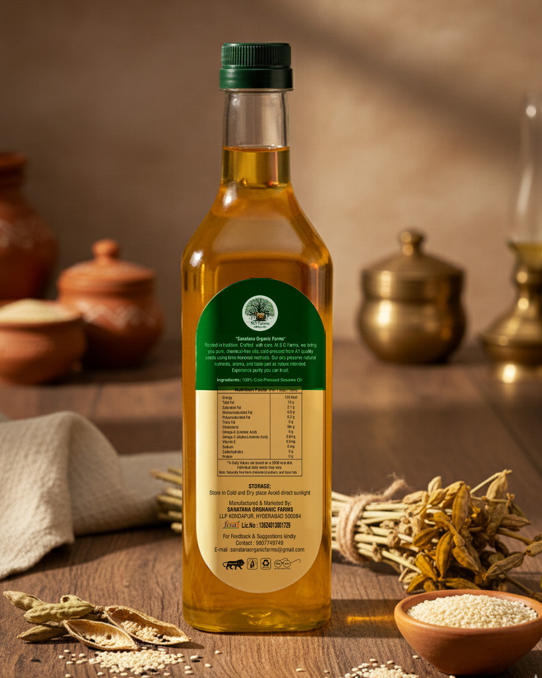 Bottle of Sesame oil with a green label on a wooden surface.